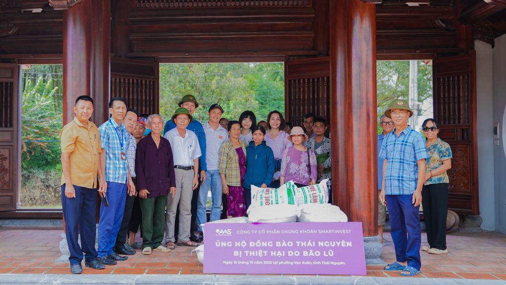 AAS team presenting charity gifts to local residents